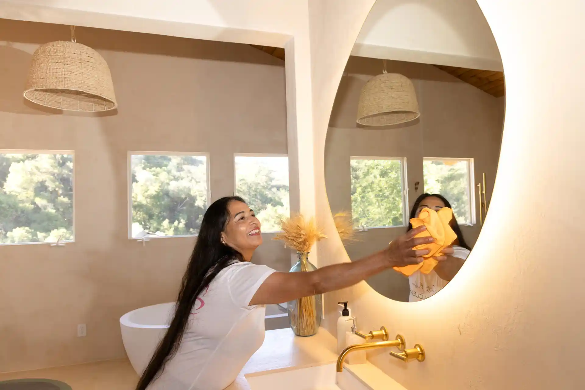 maid giving best house cleaning service in santa barbara